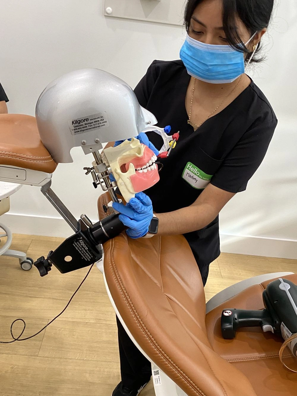 student training with dental assistant training equipment in class